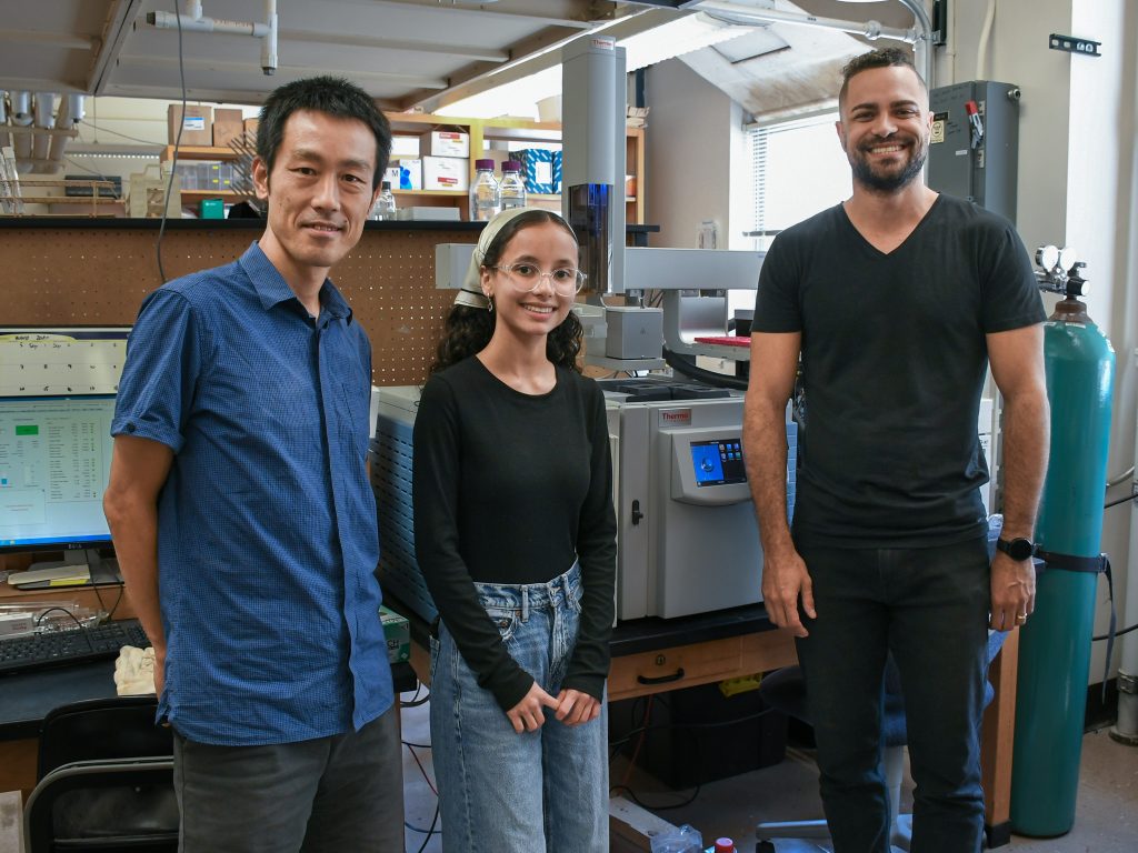 Three members of a science lab pose for the camera. 