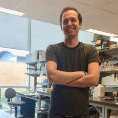 Headshot of Nathaniel Sharp in the lab.
