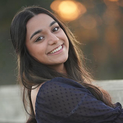 Headshot photo of Navya Francis. 