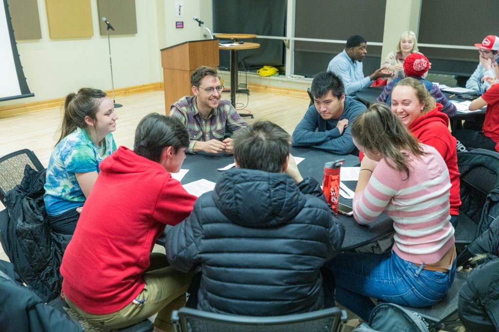 BioHouse students gather around a table.